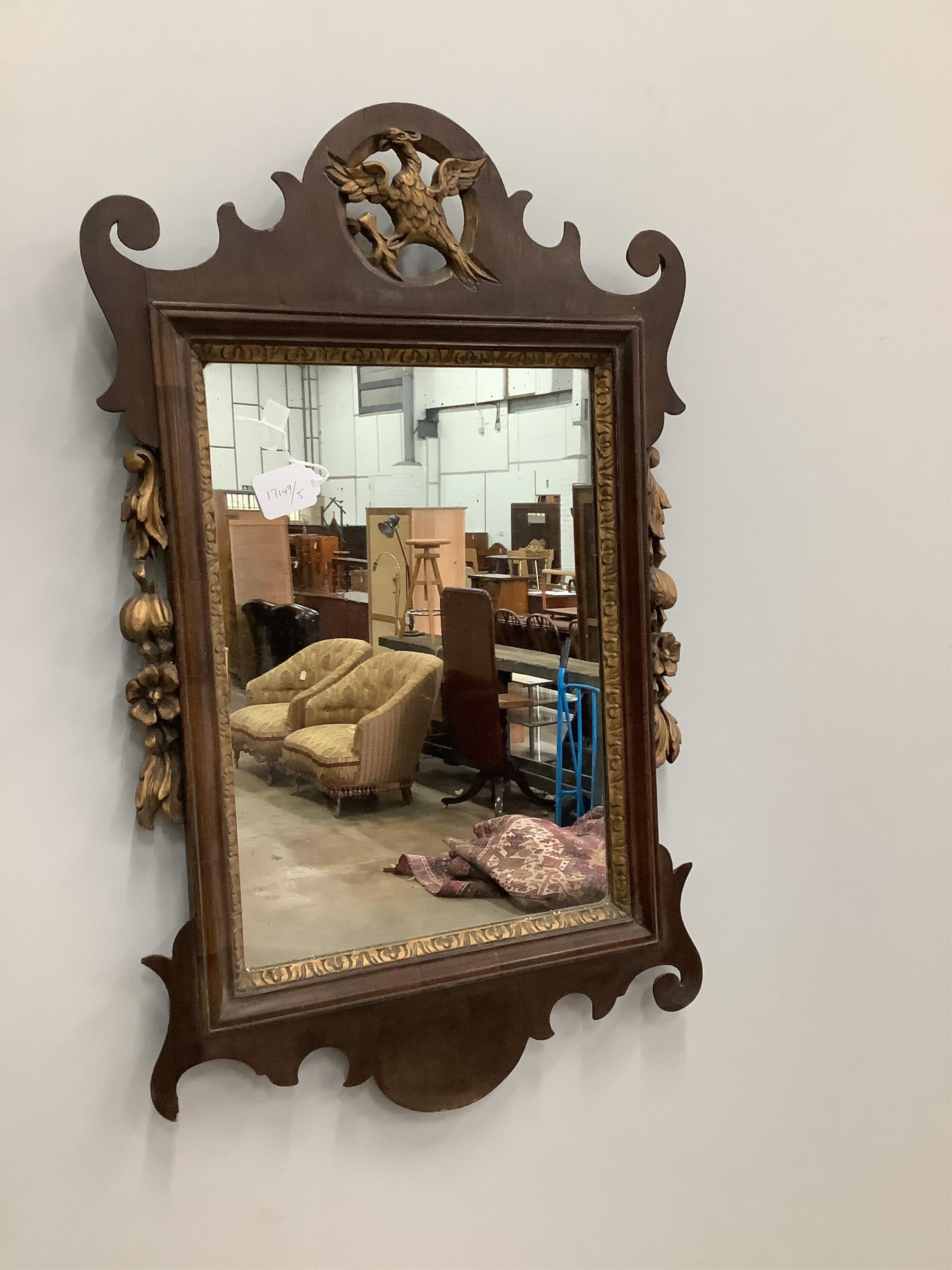 An 18th century style parcel gilt fret cut wall mirror, width 53cm, height 86cm. Condition - fair